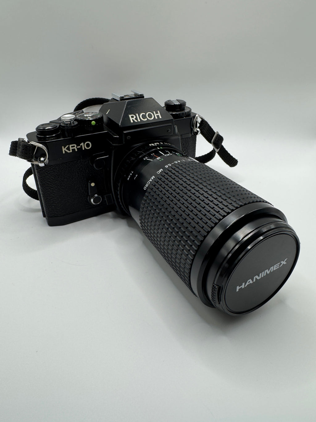 Ricoh KR-10 35mm Film Camera + Hanimex 75–200mm f/4.5–5.6 Zoom Lens (Boxed)
Fully Tested | Excellent Condition | Ready to Shoot