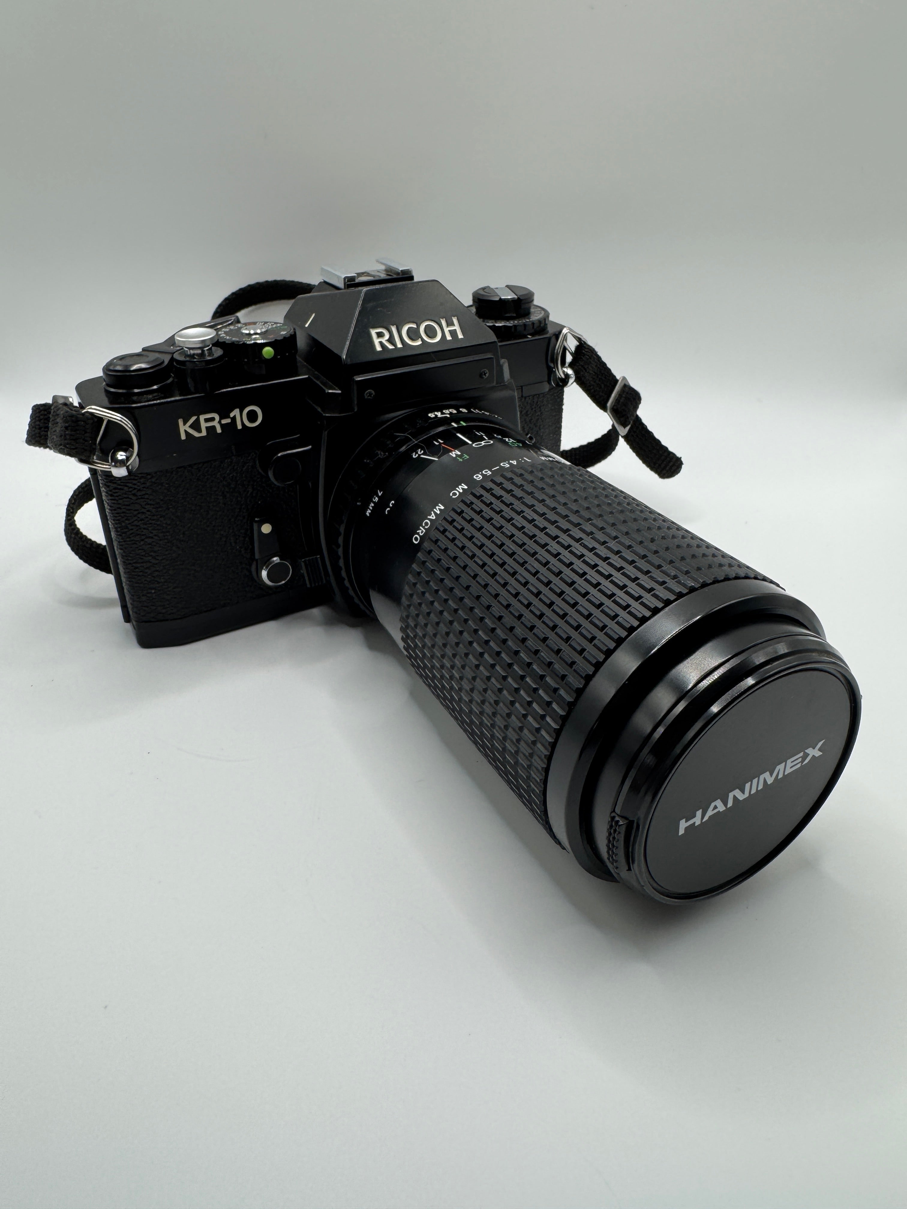 Ricoh KR-10 35mm Film Camera + Hanimex 75–200mm f/4.5–5.6 Zoom Lens (Boxed)
Fully Tested | Excellent Condition | Ready to Shoot