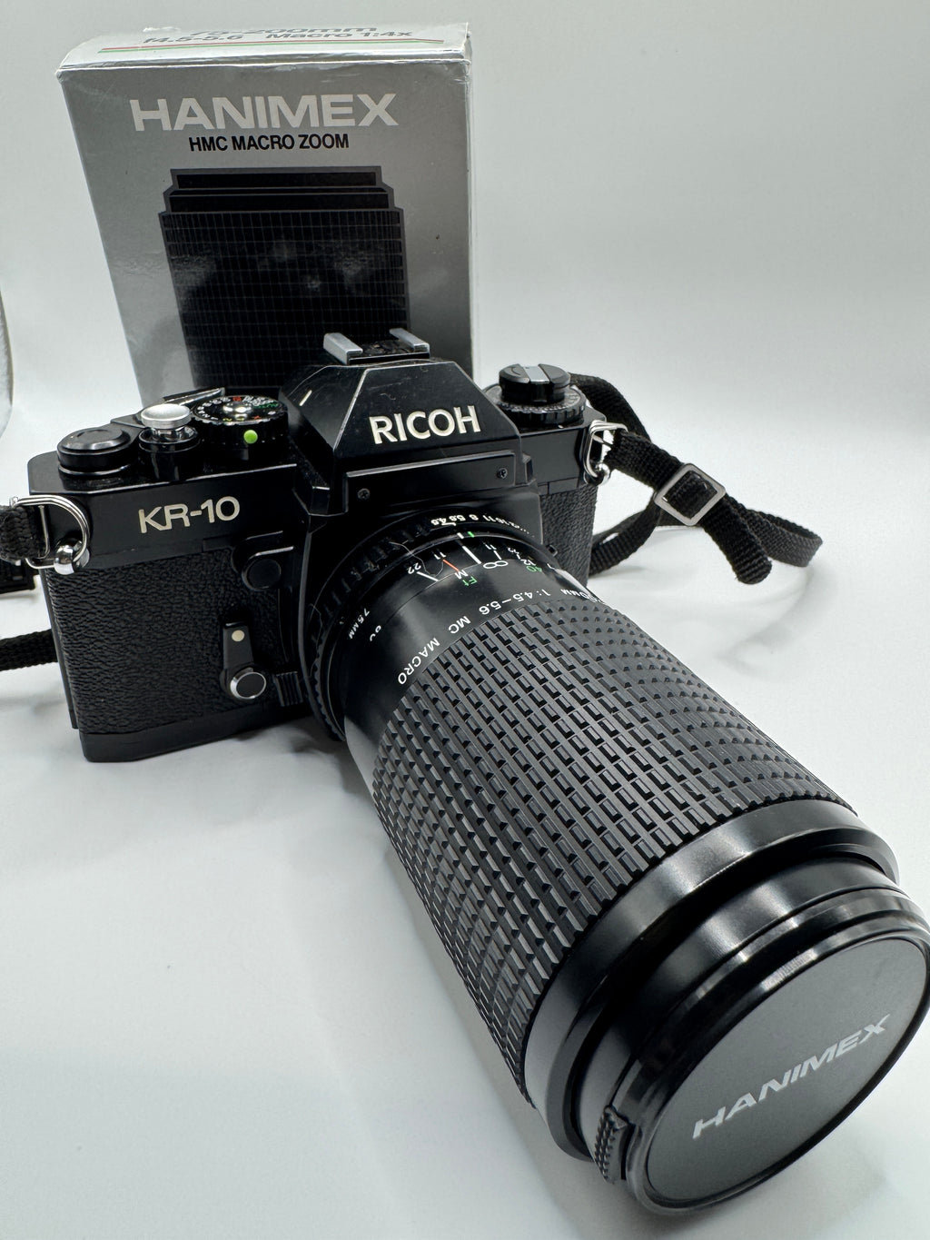 Ricoh KR-10 35mm Film Camera + Hanimex 75–200mm f/4.5–5.6 Zoom Lens (Boxed)
Fully Tested | Excellent Condition | Ready to Shoot