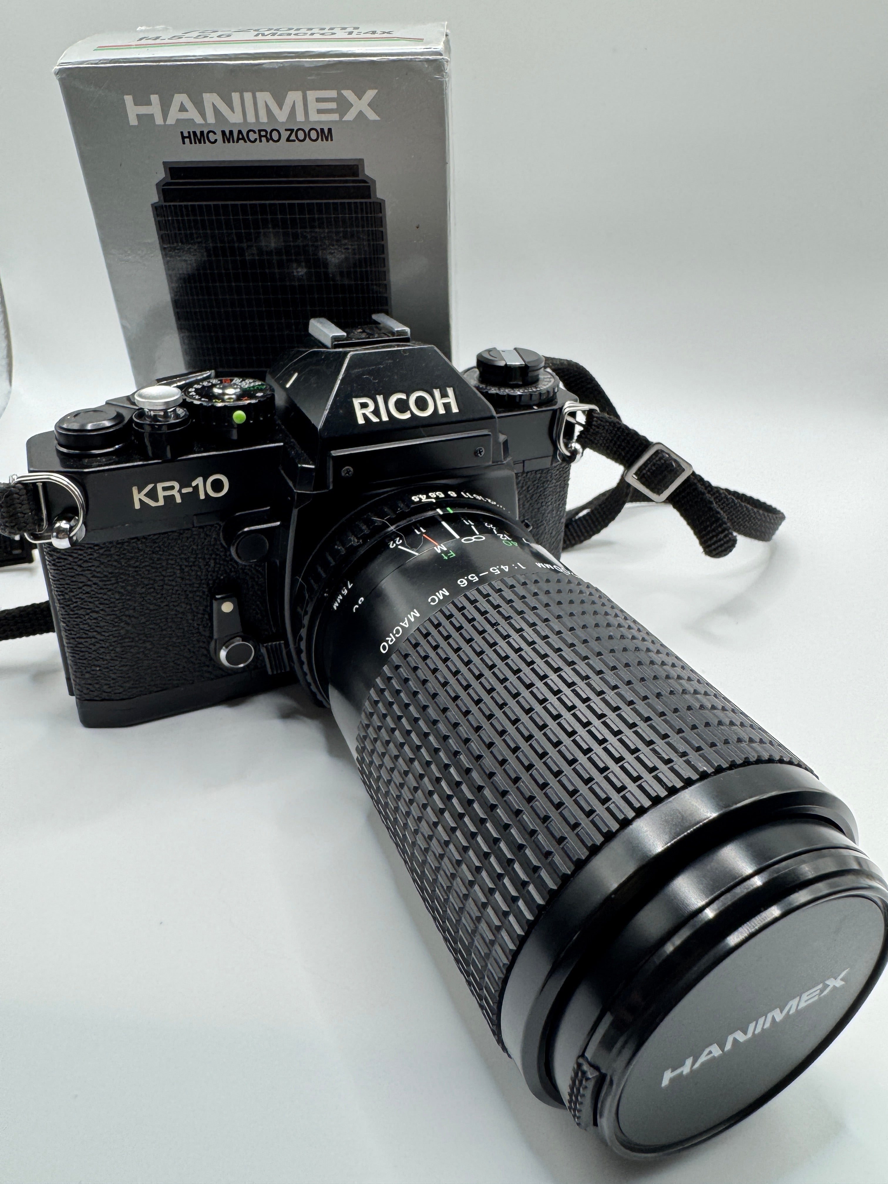 Ricoh KR-10 35mm Film Camera + Hanimex 75–200mm f/4.5–5.6 Zoom Lens (Boxed)
Fully Tested | Excellent Condition | Ready to Shoot