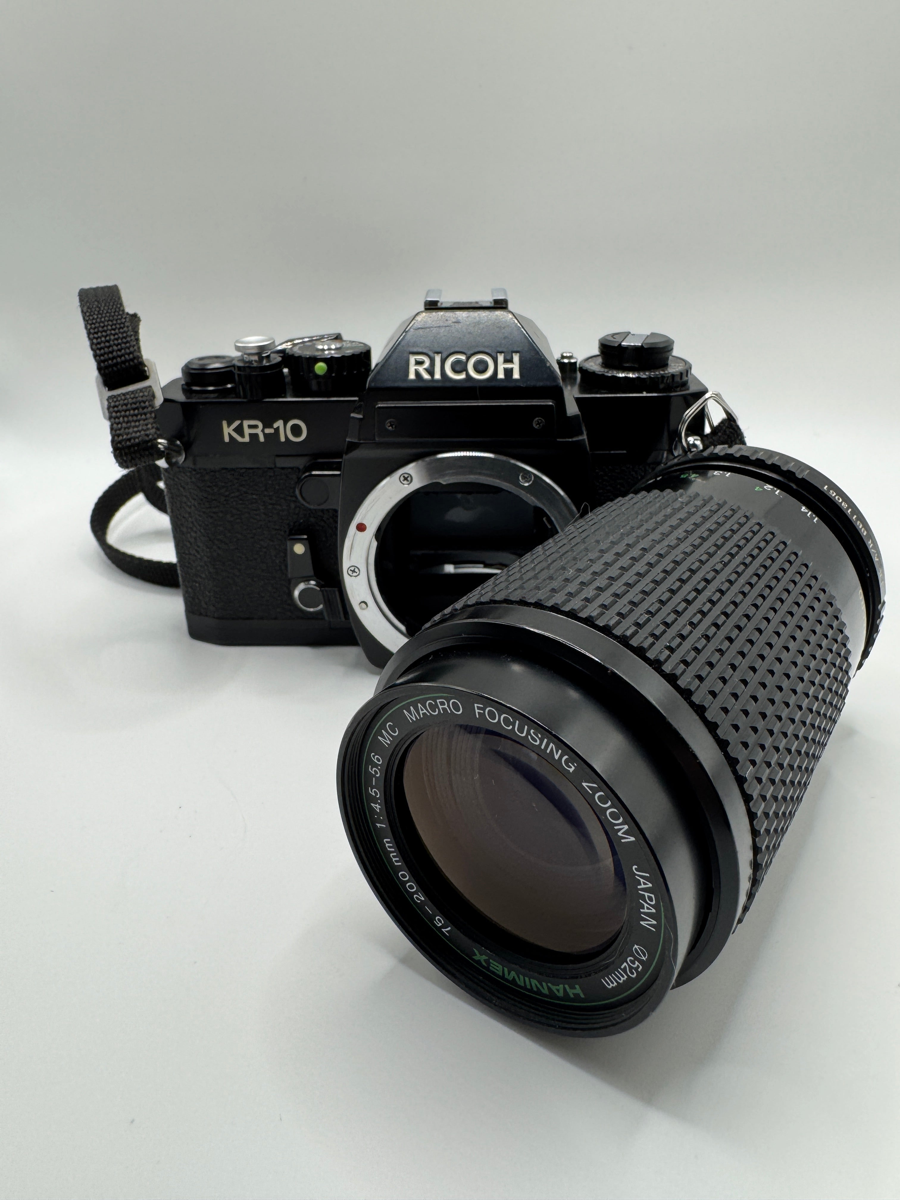 Ricoh KR-10 35mm Film Camera + Hanimex 75–200mm f/4.5–5.6 Zoom Lens (Boxed)
Fully Tested | Excellent Condition | Ready to Shoot