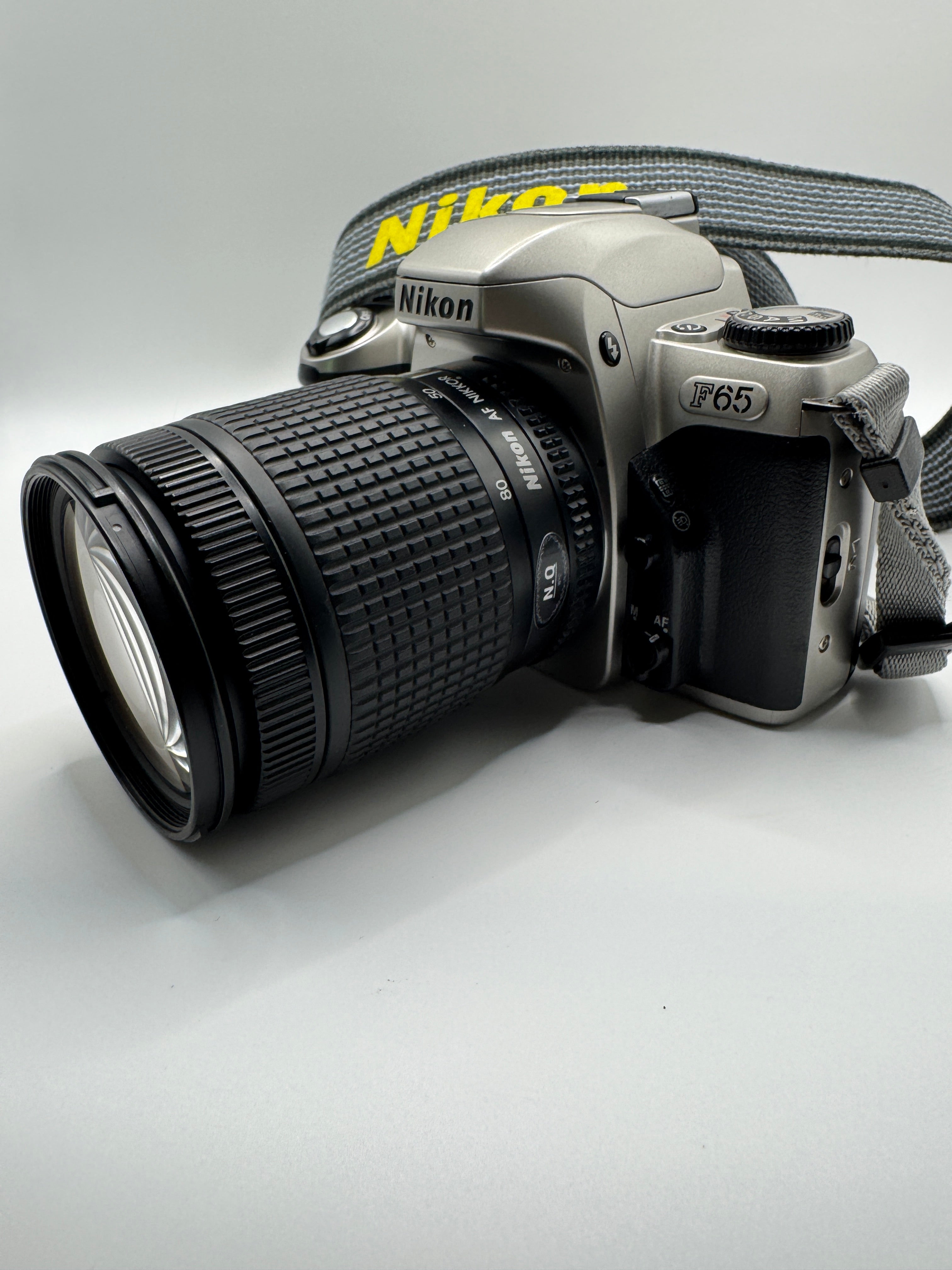 Nikon F65 (N65) 35mm Film Camera + Nikon 28–80mm Zoom Lens
Fully Tested | Excellent Condition | Ready to Shoot