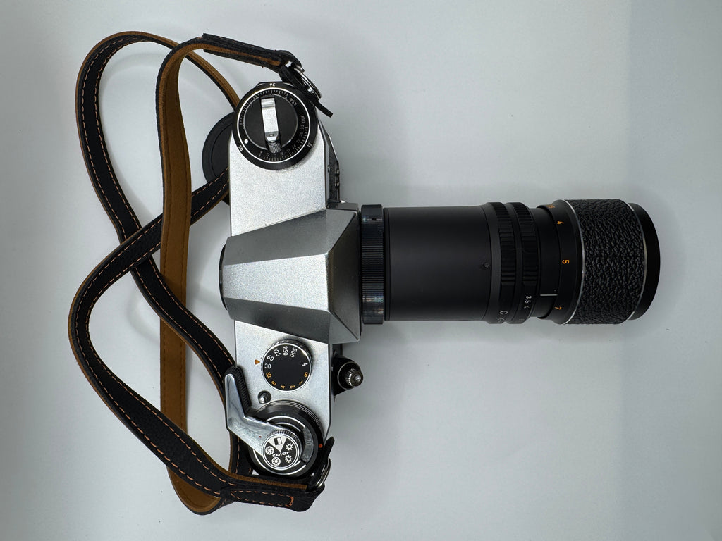 Praktica PL Nova I 35mm Film Camera + Photax 135mm f/3.5 Lens
Fully Tested | Excellent Condition | Fully Mechanical