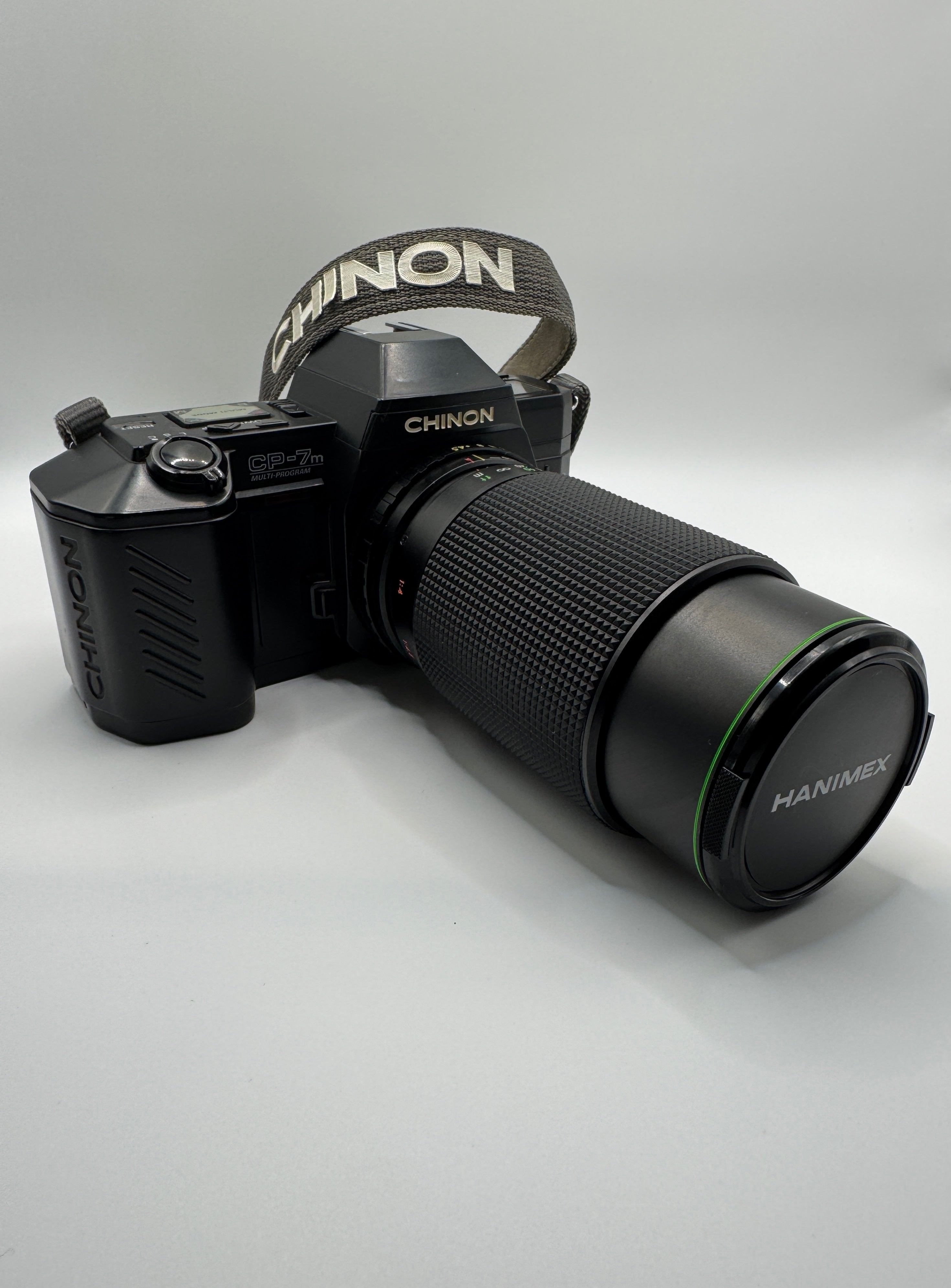 Chinon CP-7m 35mm Film Camera + Hanimex 80–200mm f/4.5 Zoom Lens
Fully Tested | Excellent Condition | Ready to Shoot