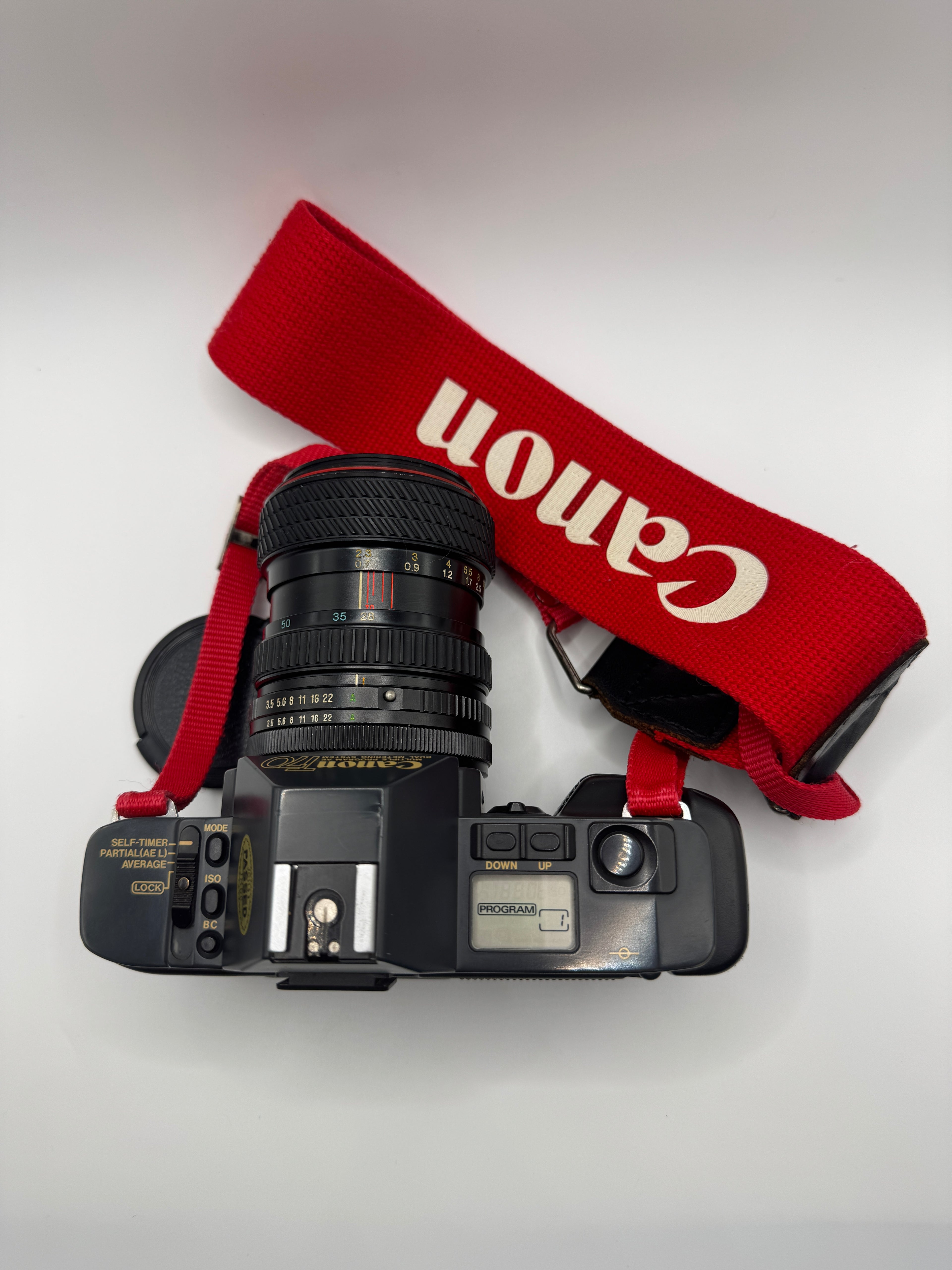 Canon T70 35mm Film Camera + Tokina 28–70mm Zoom Lens
Fully Tested | Excellent Condition | Ready to Shoot