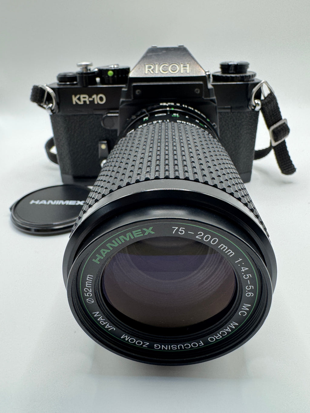 Ricoh KR-10 35mm Film Camera + Hanimex 75–200mm f/4.5–5.6 Zoom Lens (Boxed)
Fully Tested | Excellent Condition | Ready to Shoot