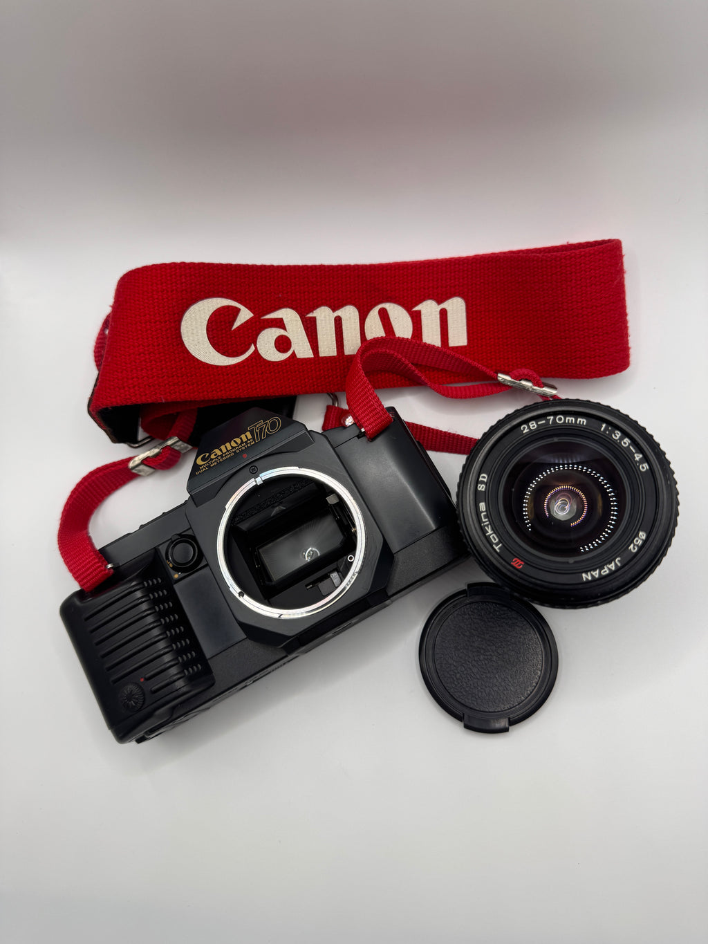 Canon T70 35mm Film Camera + Tokina 28–70mm Zoom Lens
Fully Tested | Excellent Condition | Ready to Shoot