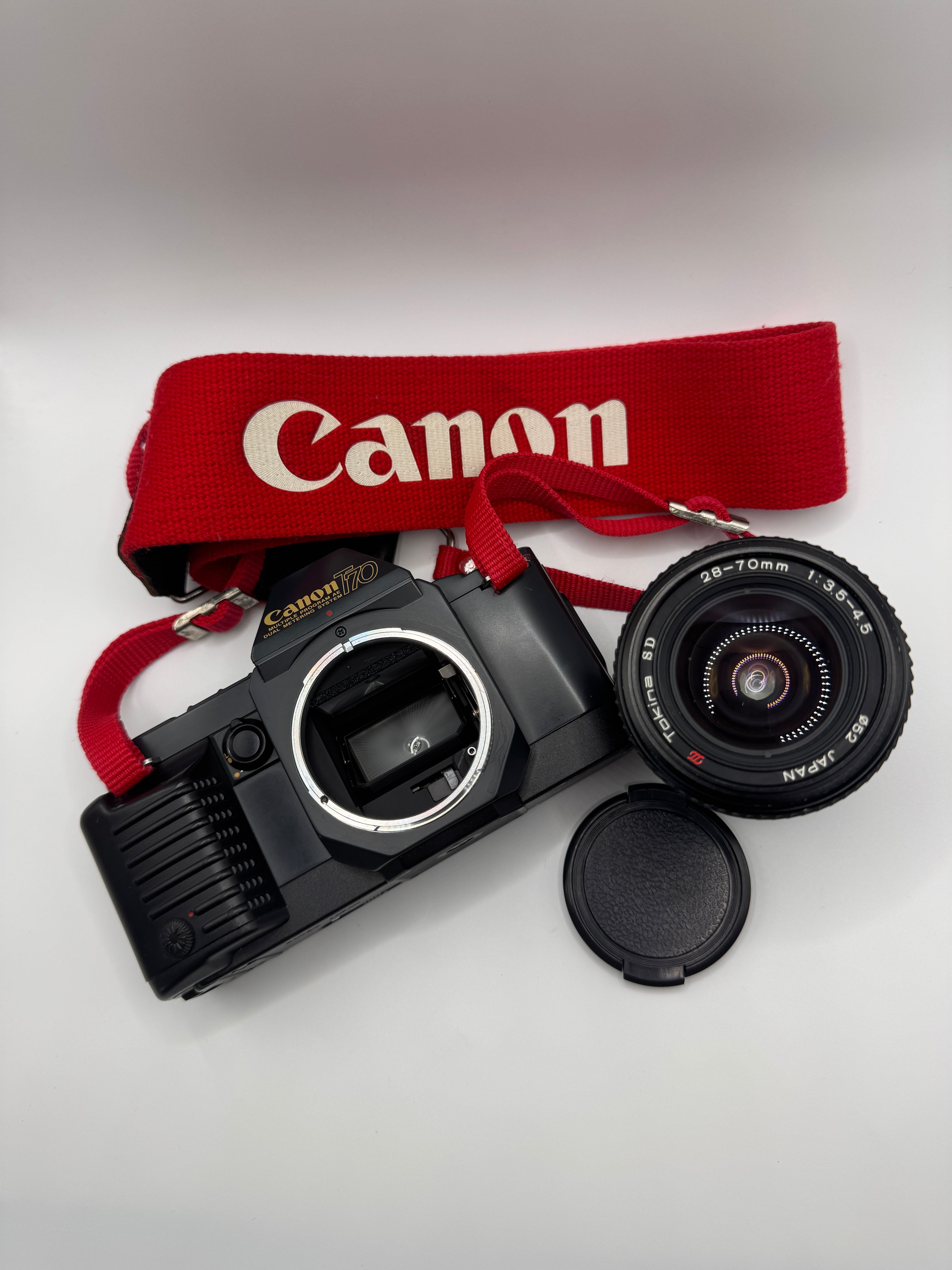 Canon T70 35mm Film Camera + Tokina 28–70mm Zoom Lens
Fully Tested | Excellent Condition | Ready to Shoot