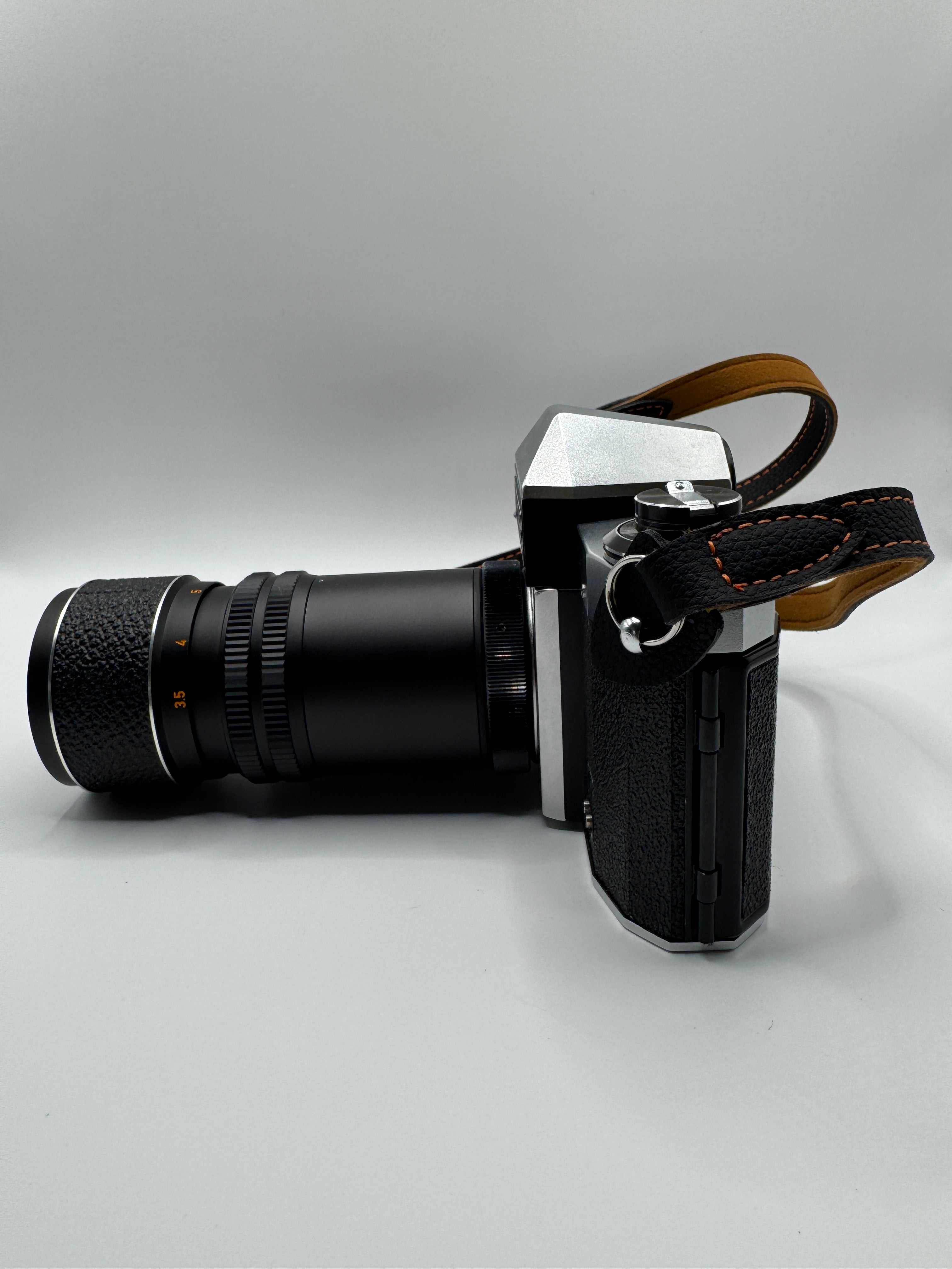 Praktica PL Nova I 35mm Film Camera + Photax 135mm f/3.5 Lens
Fully Tested | Excellent Condition | Fully Mechanical