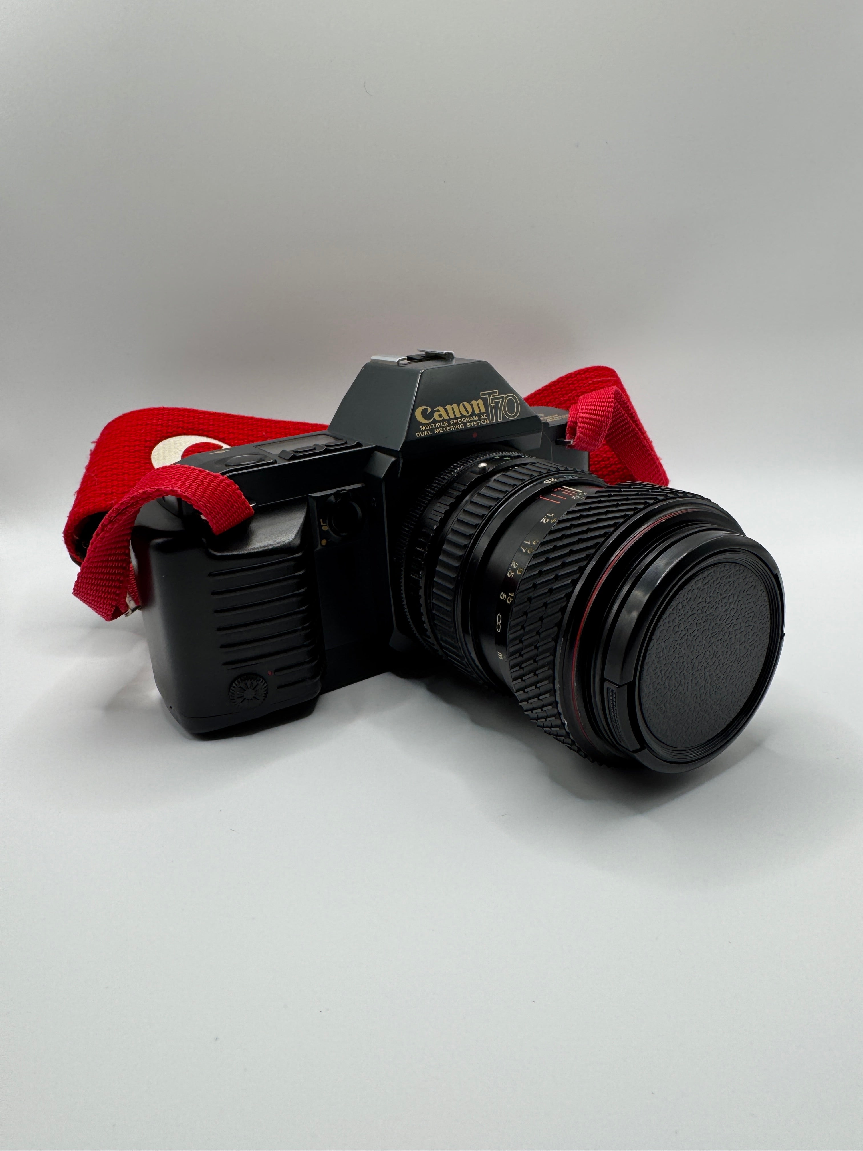 Canon T70 35mm Film Camera + Tokina 28–70mm Zoom Lens
Fully Tested | Excellent Condition | Ready to Shoot