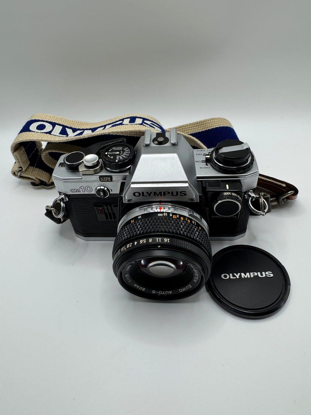Olympus OM-10 35mm Film Camera + Zuiko 50mm f/1.8 Lens
Fully Tested | Excellent Condition | Ready to Shoot