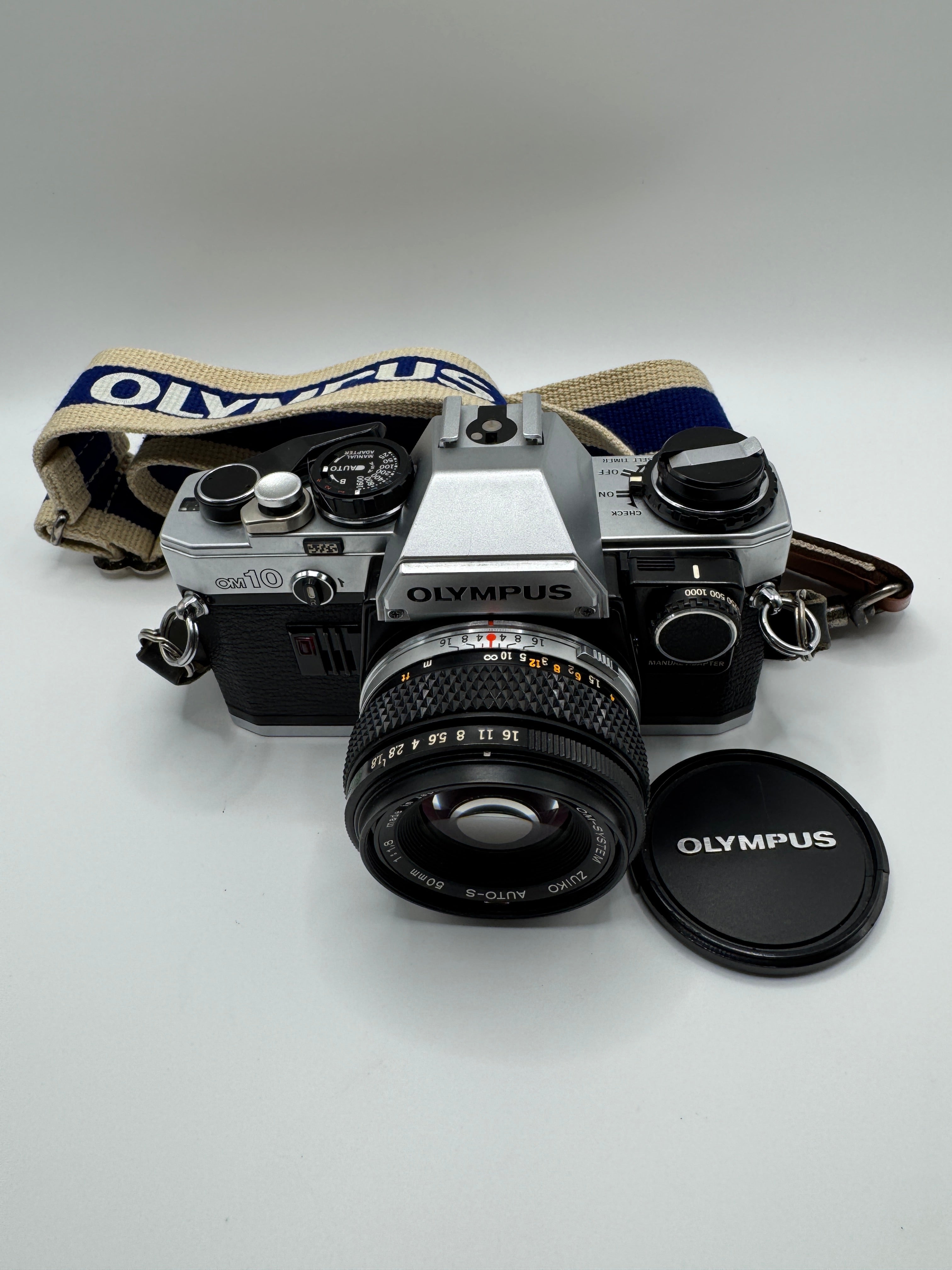Olympus OM-10 35mm Film Camera + Zuiko 50mm f/1.8 Lens
Fully Tested | Excellent Condition | Ready to Shoot