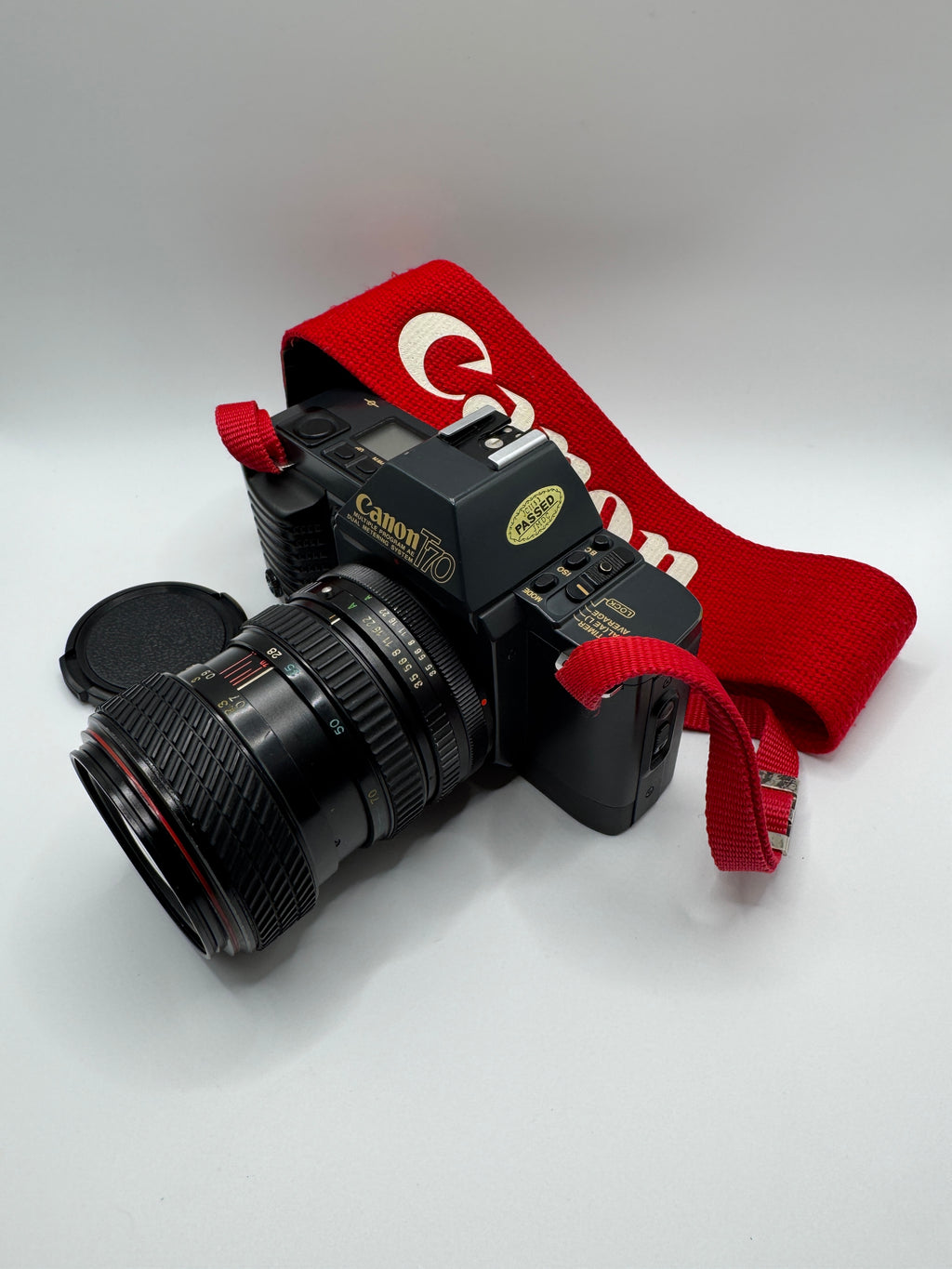 Canon T70 35mm Film Camera + Tokina 28–70mm Zoom Lens
Fully Tested | Excellent Condition | Ready to Shoot