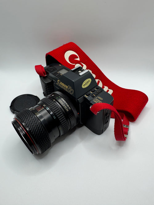 Canon T70 35mm Film Camera + Tokina 28–70mm Zoom Lens
Fully Tested | Excellent Condition | Ready to Shoot